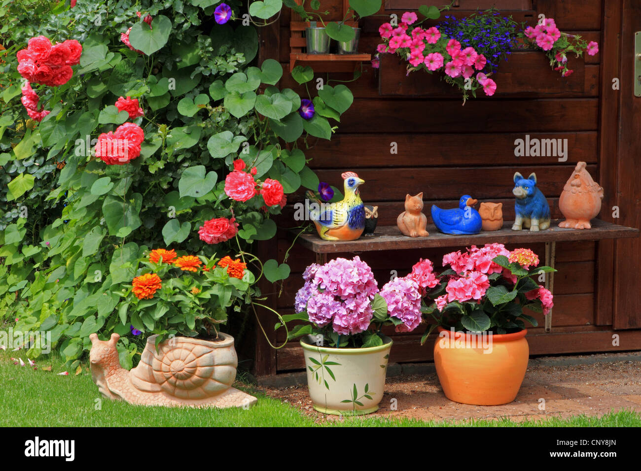 Summer house with flowers and garden figures, Germany Stock Photo - Alamy