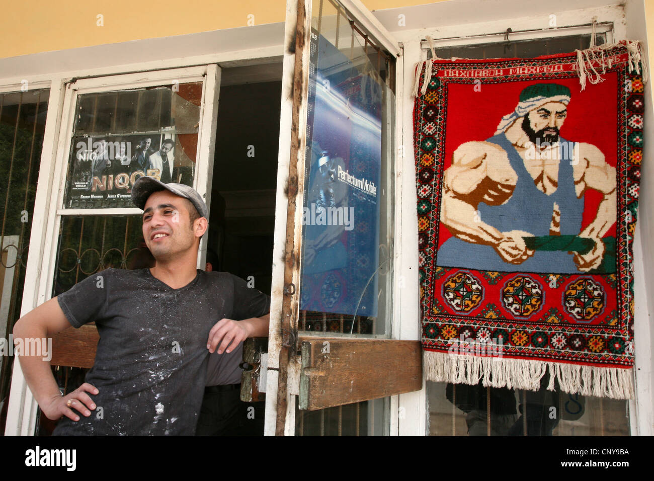 Carpet with a portrait of Uzbek national hero Pakhlavan Mahmud in Khiva, Uzbekistan. Stock Photo