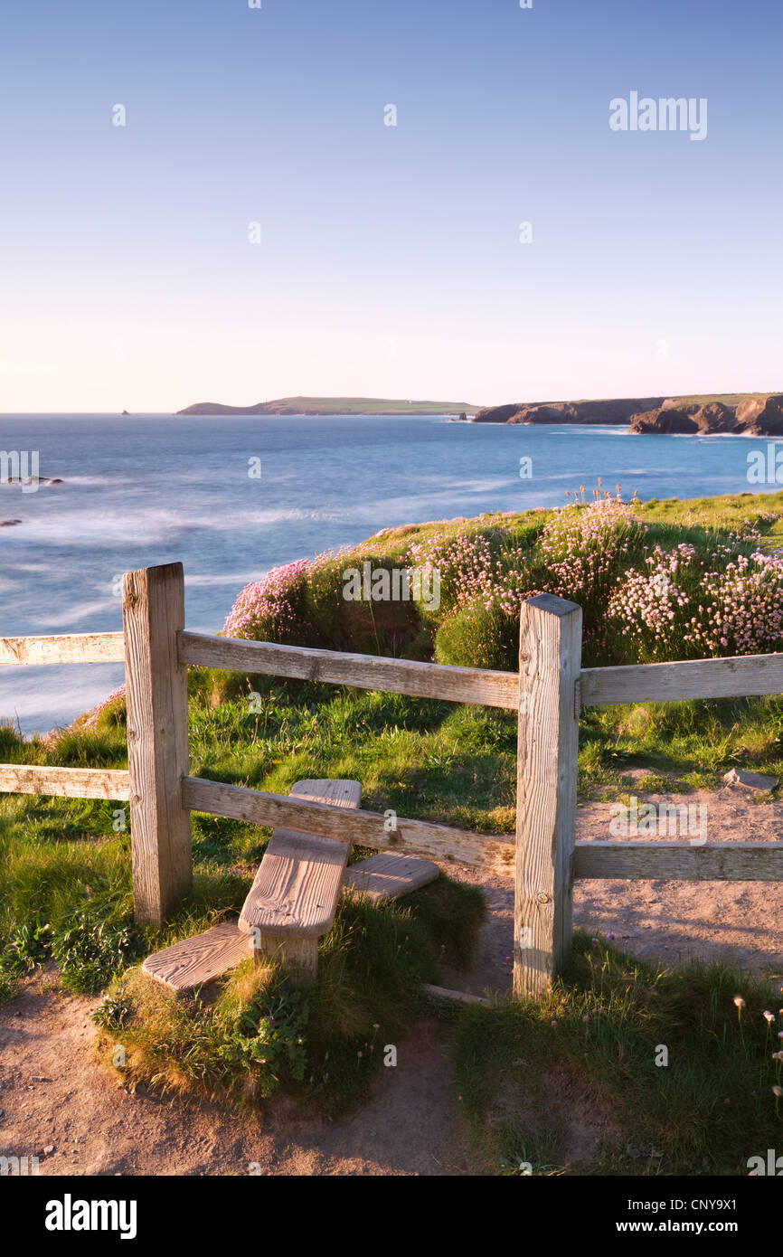 Wooden stile on Cornish clifftops near Porthcothan Bay with views to Trevose Head, Cornwall, England. Spring (May) 2010. Stock Photo