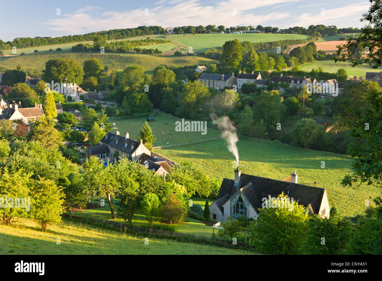 Cottages nestled into the valley in the picturesque Cotswolds village of Naunton, Gloucestershire, England. Summer (July) 2010. Stock Photo