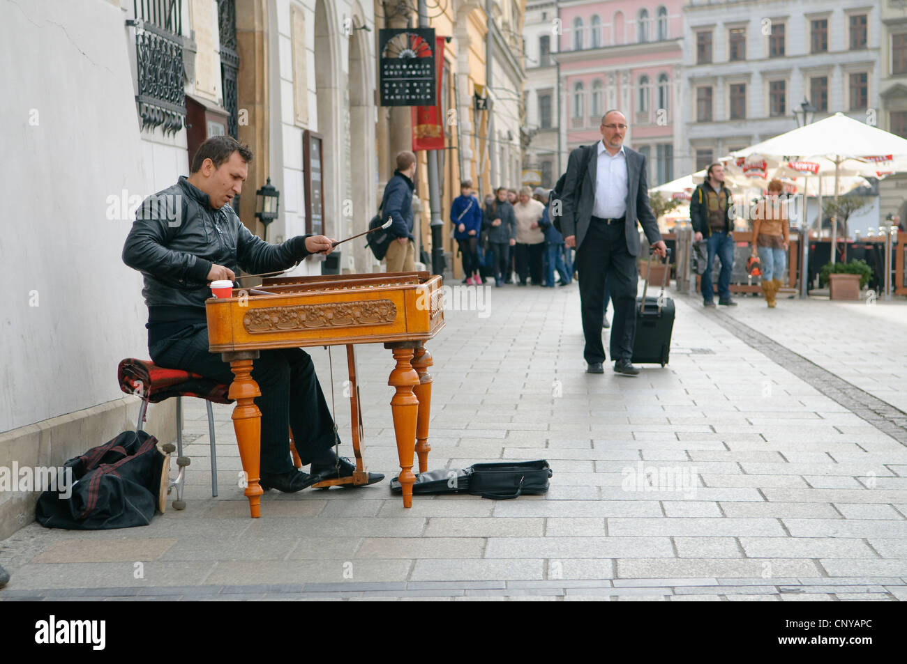 Busker playing the dulcimer in Market Square, Krakow, Poland. Stock Photo