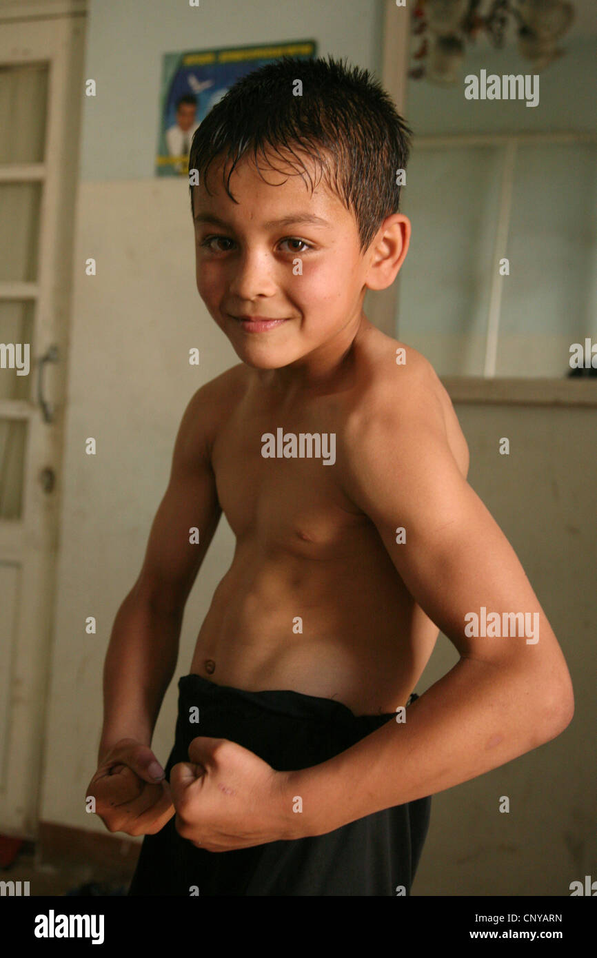 Young Uzbek athlete poses after a training in a gym in Khiva ...