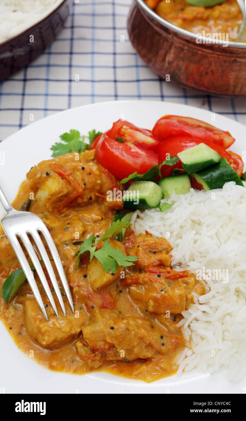 A Kerala or South Indian chicken curry, which includes tomatoes and coconut milk garnished with