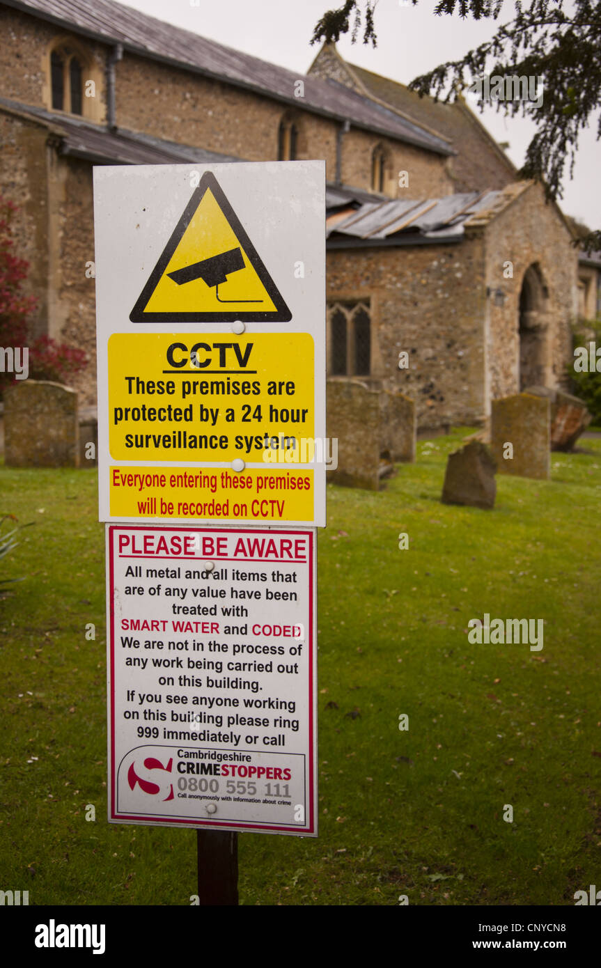 CCTV and security signs at church after thieves stole lead from roof Stock Photo