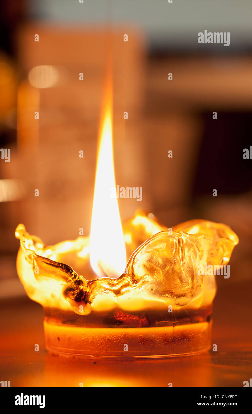 Melting plastic lit candle with big flame Stock Photo Alamy