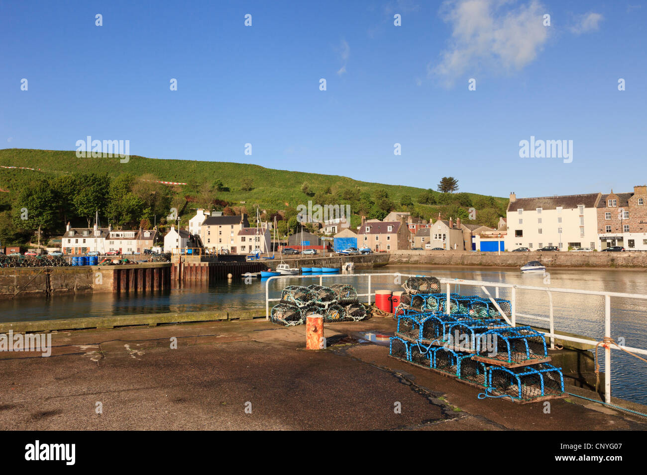 Lobster pots on the quayside of the small fishing port and harbour at Stonehaven, Aberdeenshire, Scotland, UK. Stock Photo