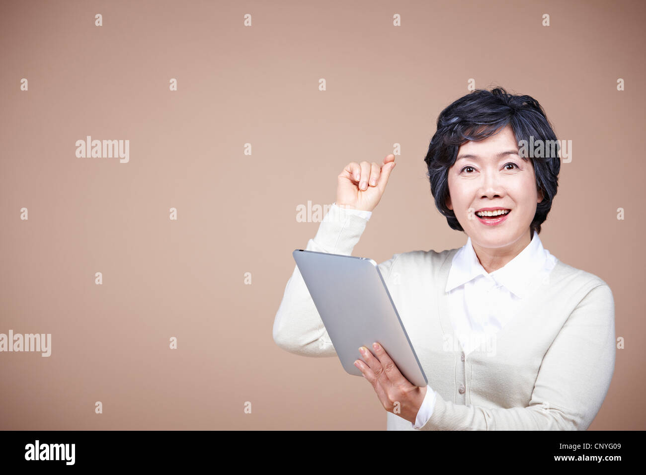 Smile thinking tablet woman hi-res stock photography and images - Alamy