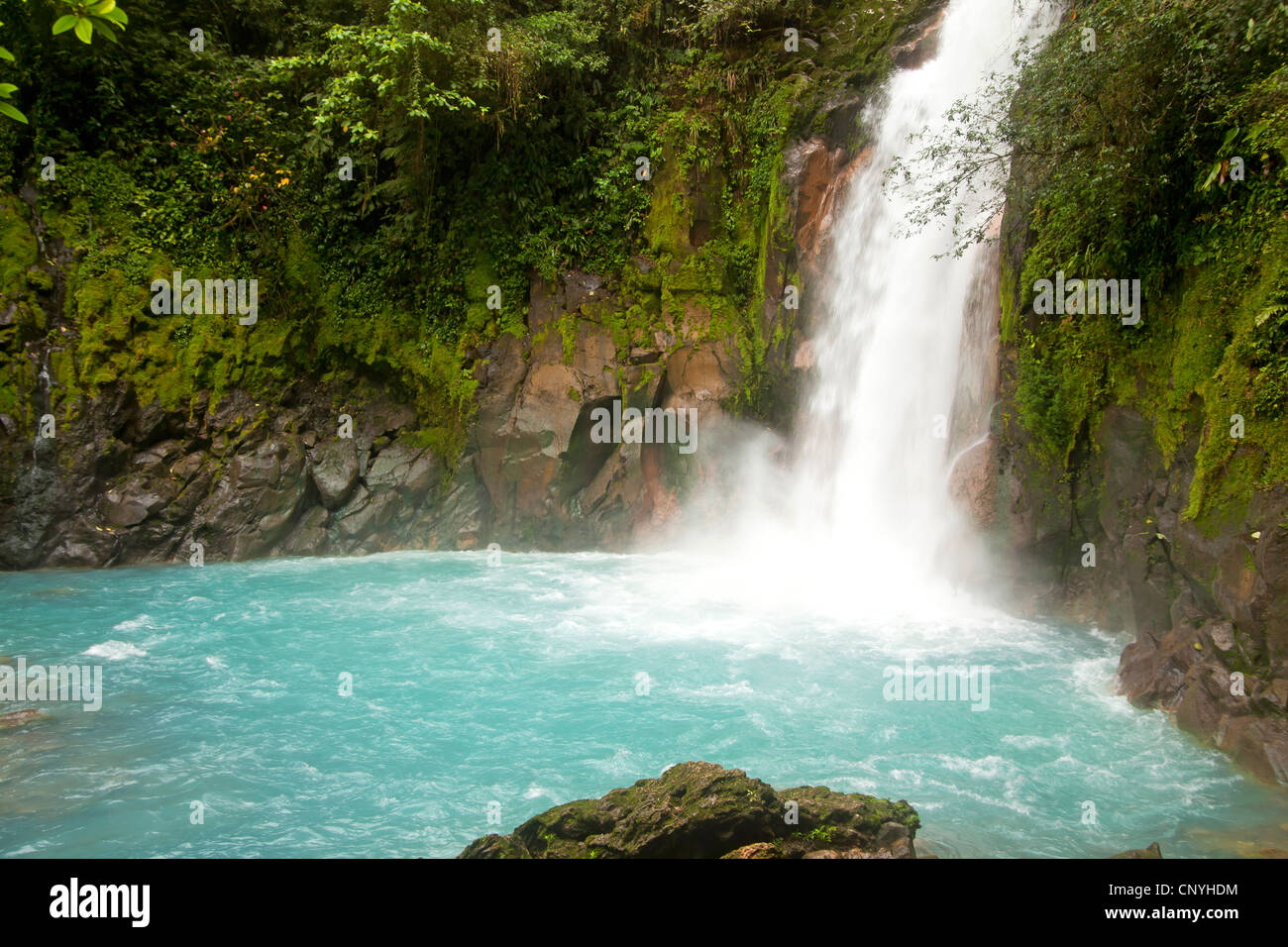 Waterfall with the blue waters of the Rio Celeste in VolcanTenorio