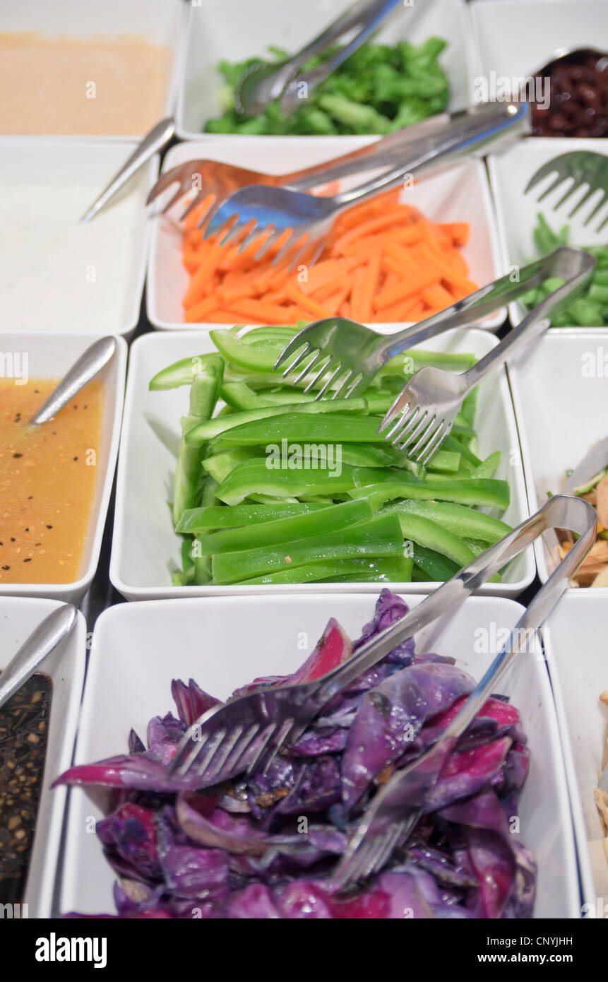 Chopped vegetables in containers at a salad bar Stock Photo