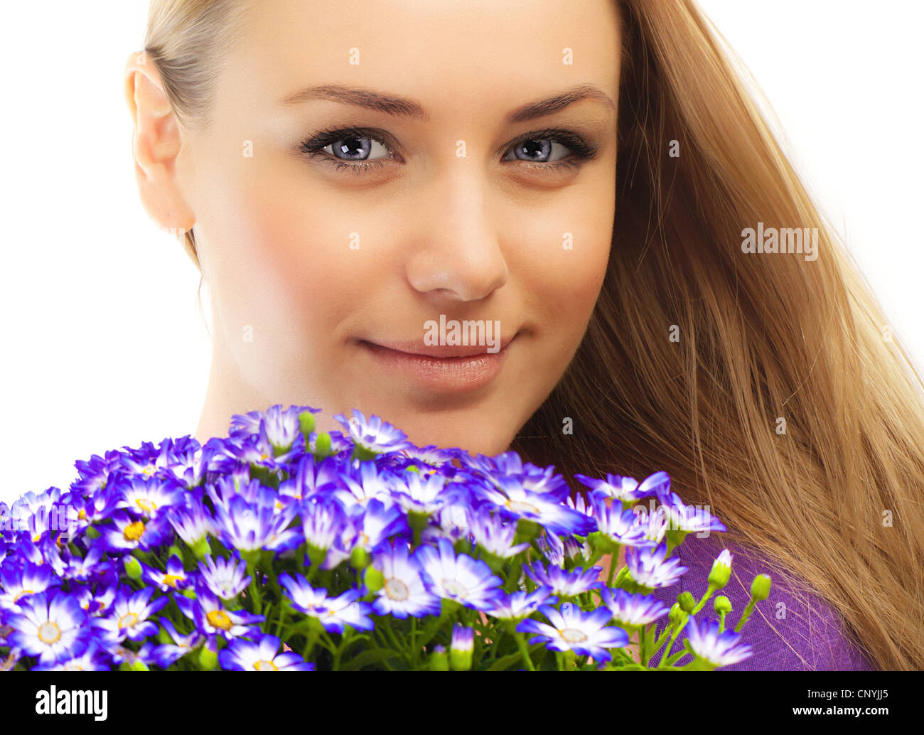 Beautiful female holding flowers, girl with bouquet of spring plant