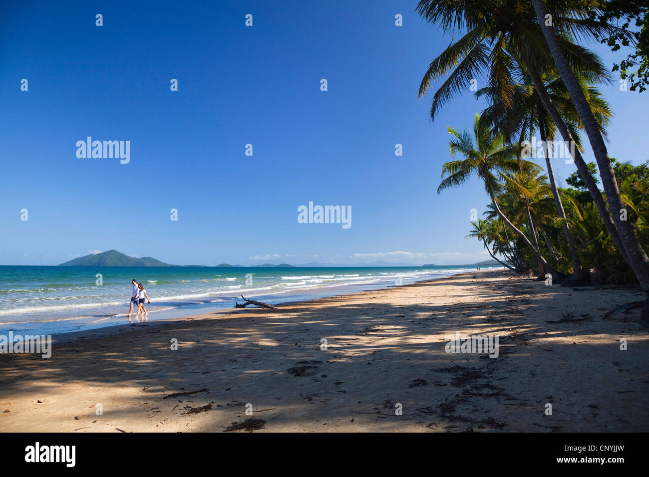 tourists on the South Mission Beach near Innisfail with Dunk Island, Australia, Queensland Stock Photo