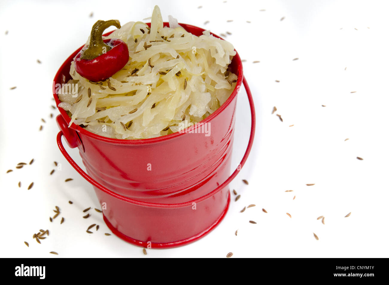 sauerkraut with caraway seeds in a red bucket Stock Photo