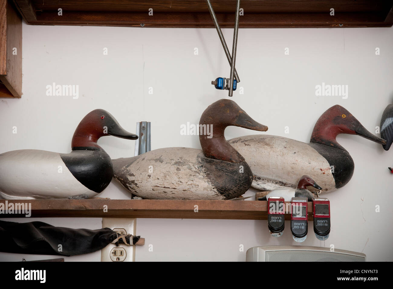 Lined decoy ducks face forward. Stock Photo