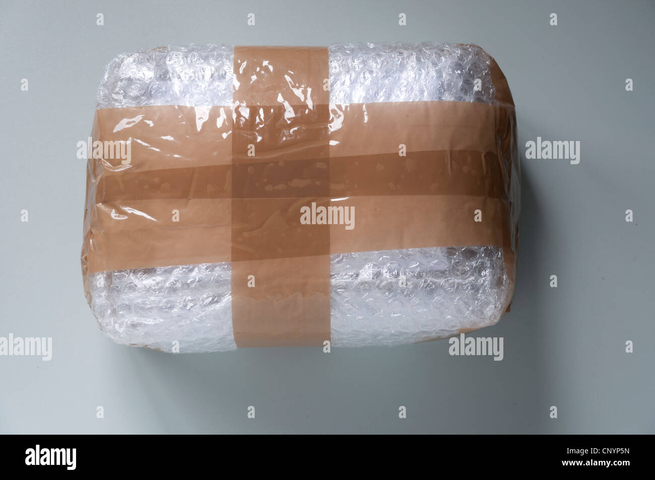 Fragile item wrapped in bubble wrap Stock Photo Alamy