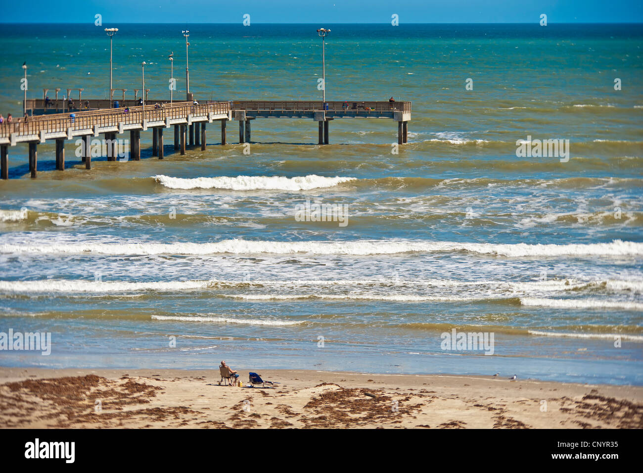 Beach with fishing pier in Port Aransas Texas Stock Photo