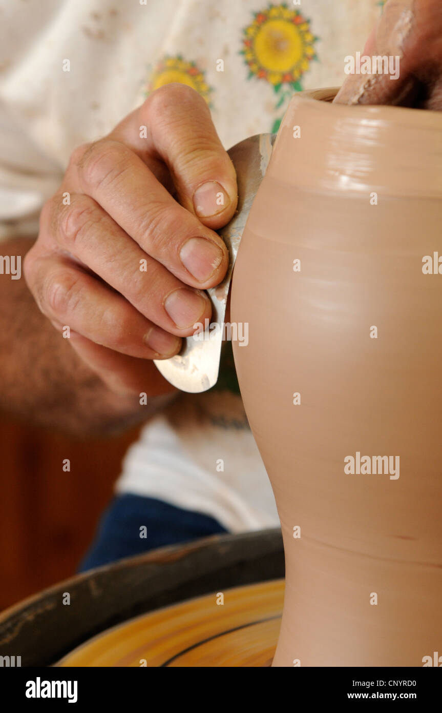 Potter at his wheel and kiln in his Vidlin Shetland Scotland