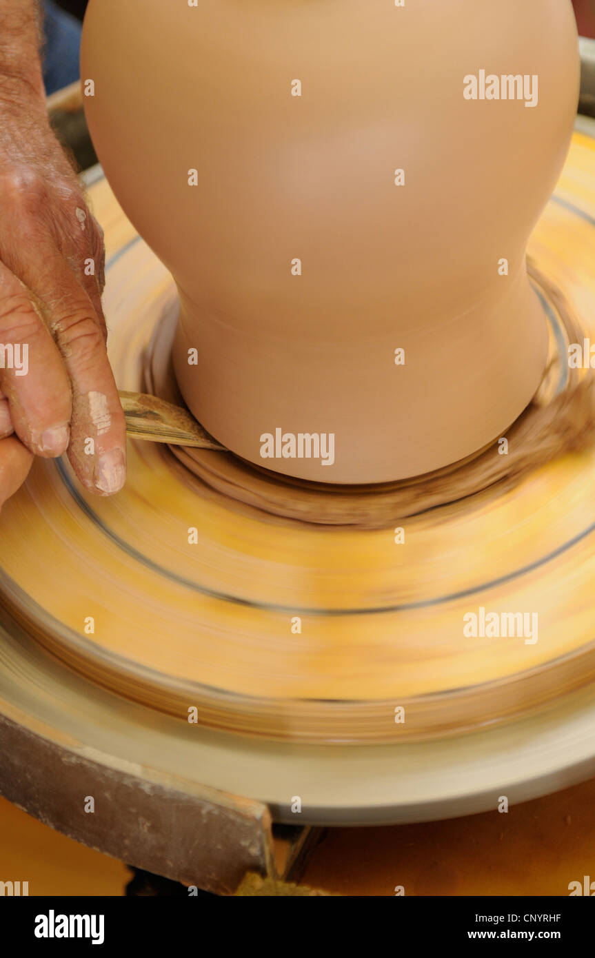 Potter at his wheel and kiln in his Vidlin Shetland Scotland