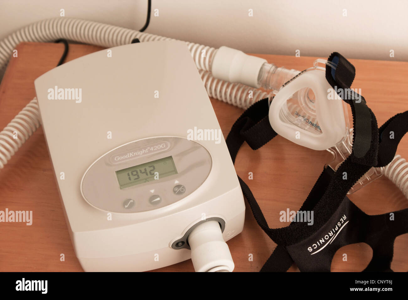 CPAP mask and machine used for the treatment of sleep apnea. Stock Photo