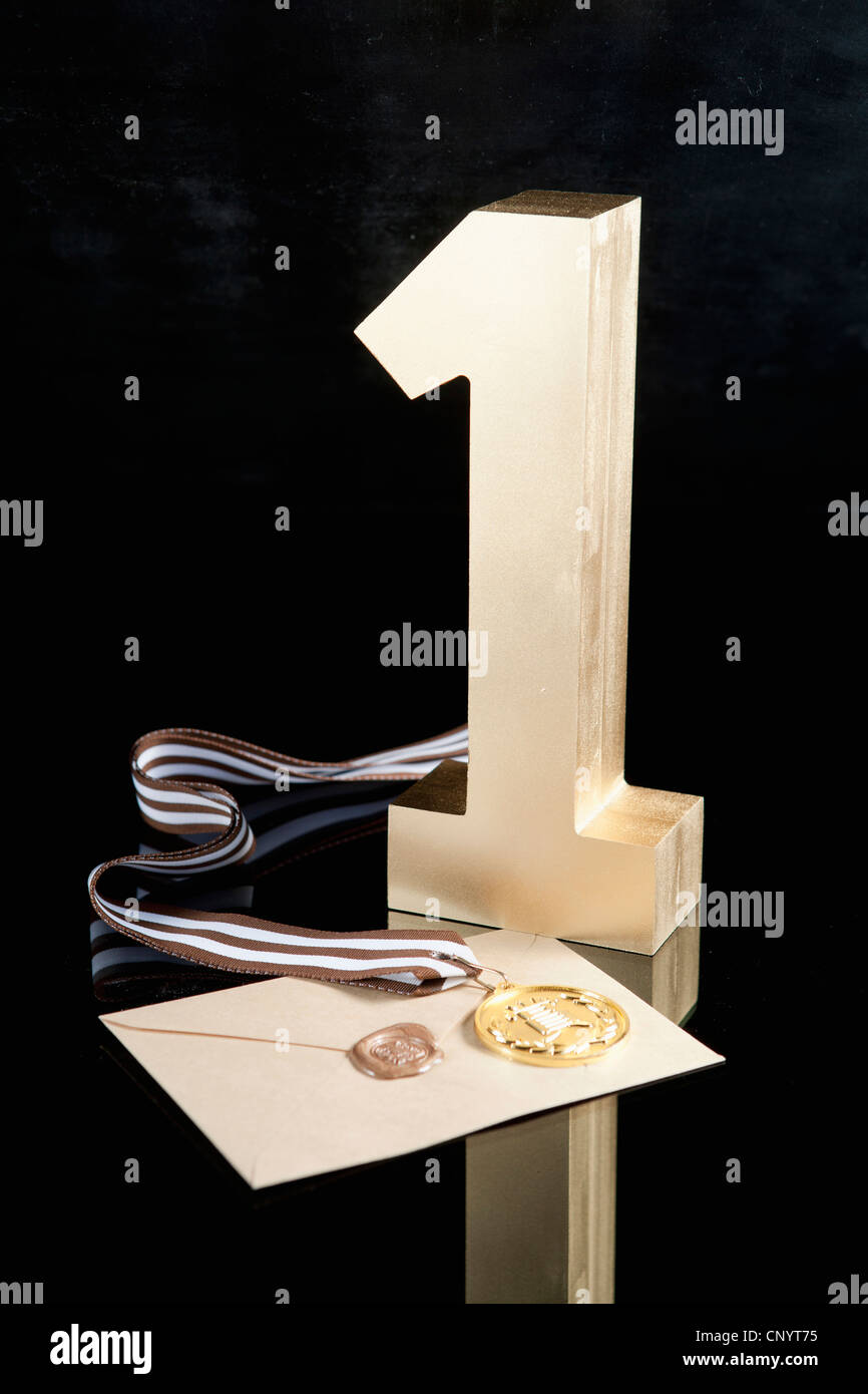 The golden number one, prize medal, and letter of certificate Stock