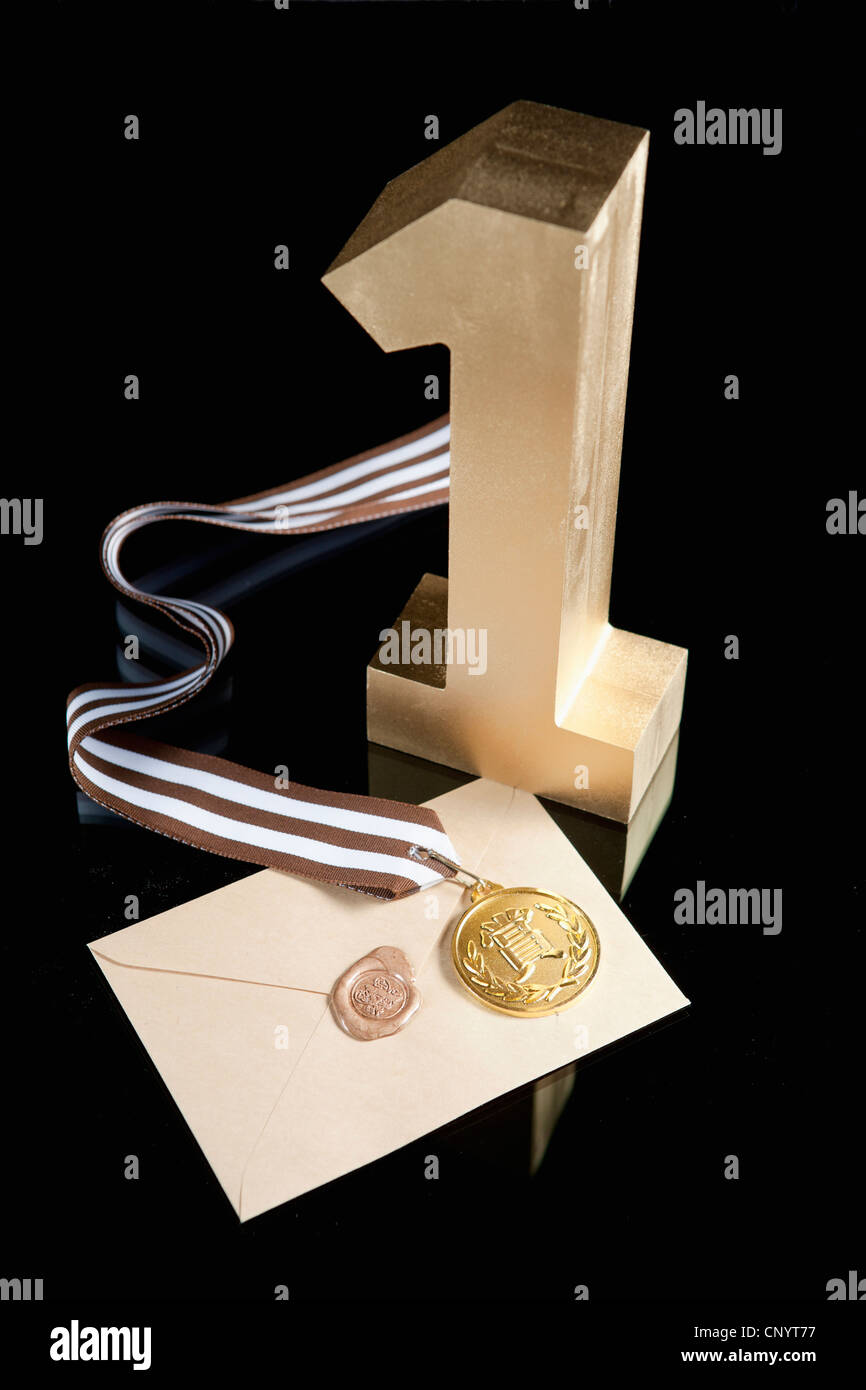 The golden number one, prize medal, and letter of certificate Stock