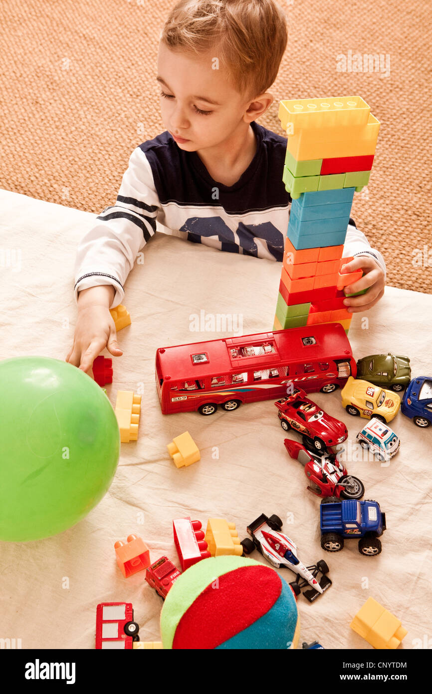 a child playing with toys Stock Photo