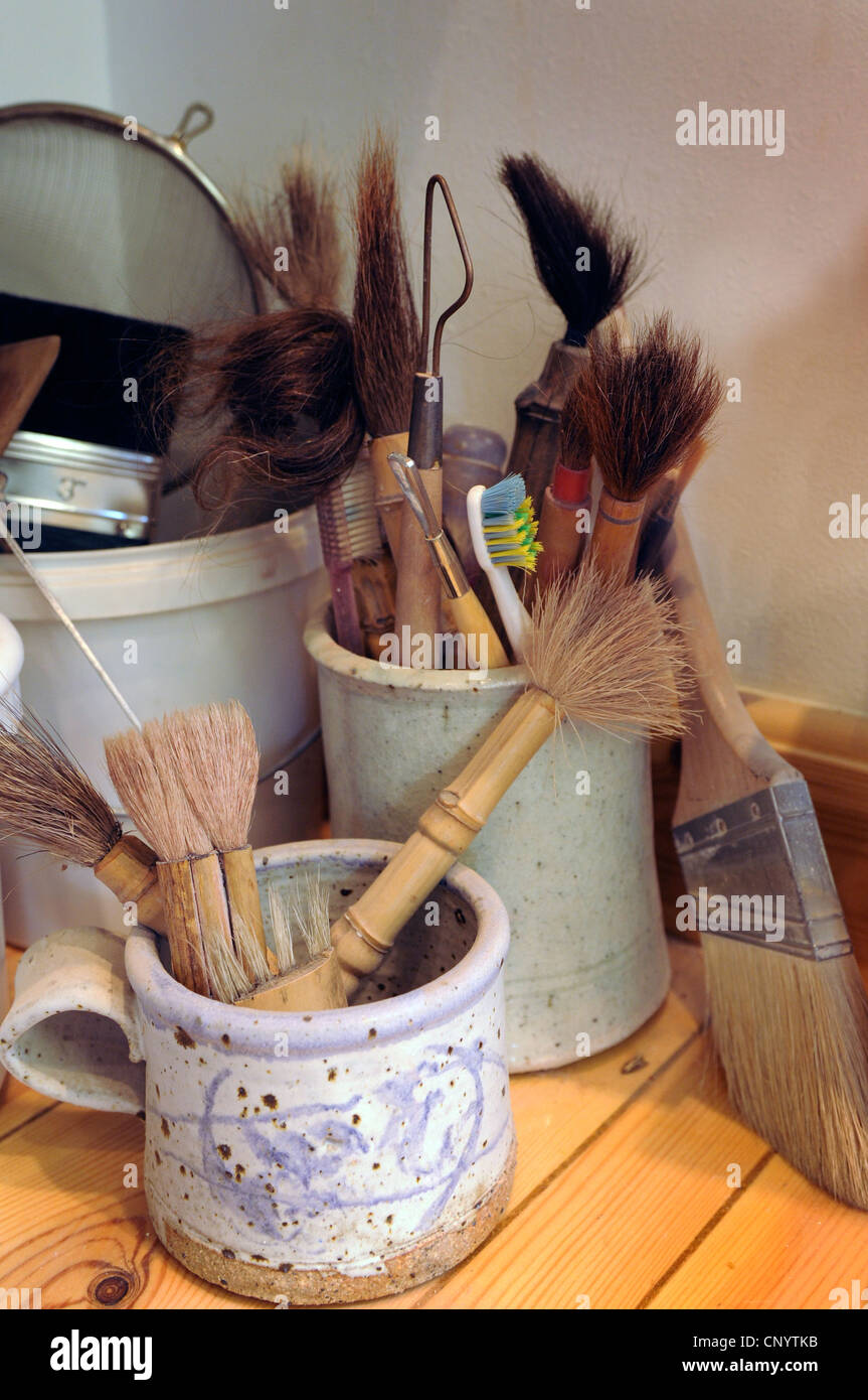 Potter at his wheel and kiln in his Vidlin Shetland Scotland