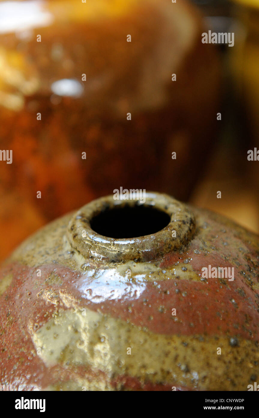 Potter at his wheel and kiln in his Vidlin Shetland Scotland