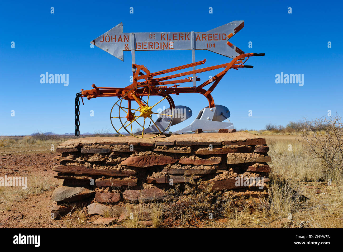 Name sign on an old fashioned plow at the entrance of a farm near Keetmanshoop. Namakwaland, Namibia. Stock Photo