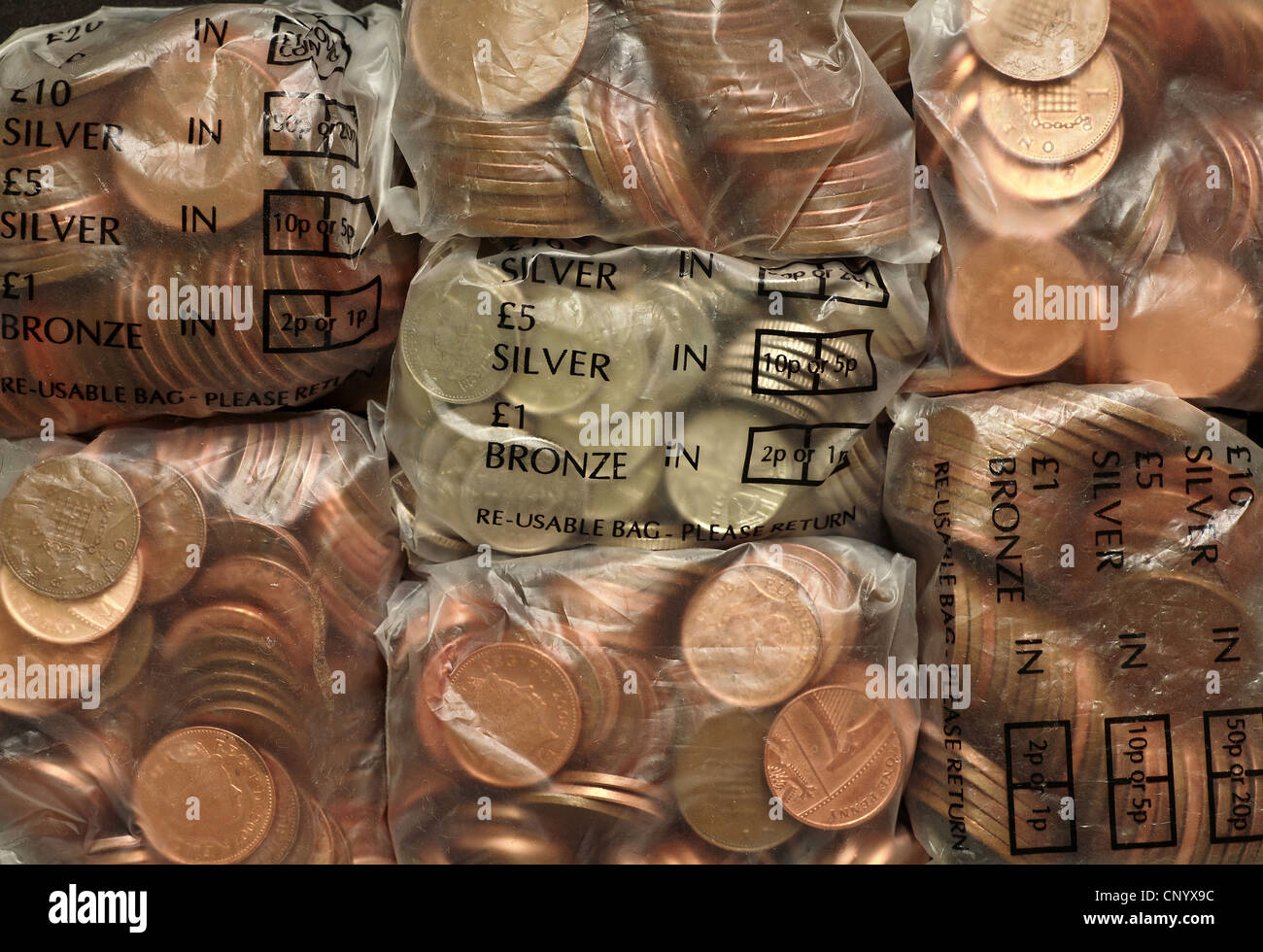 Bags of silver and bronze UK coins Stock Photo