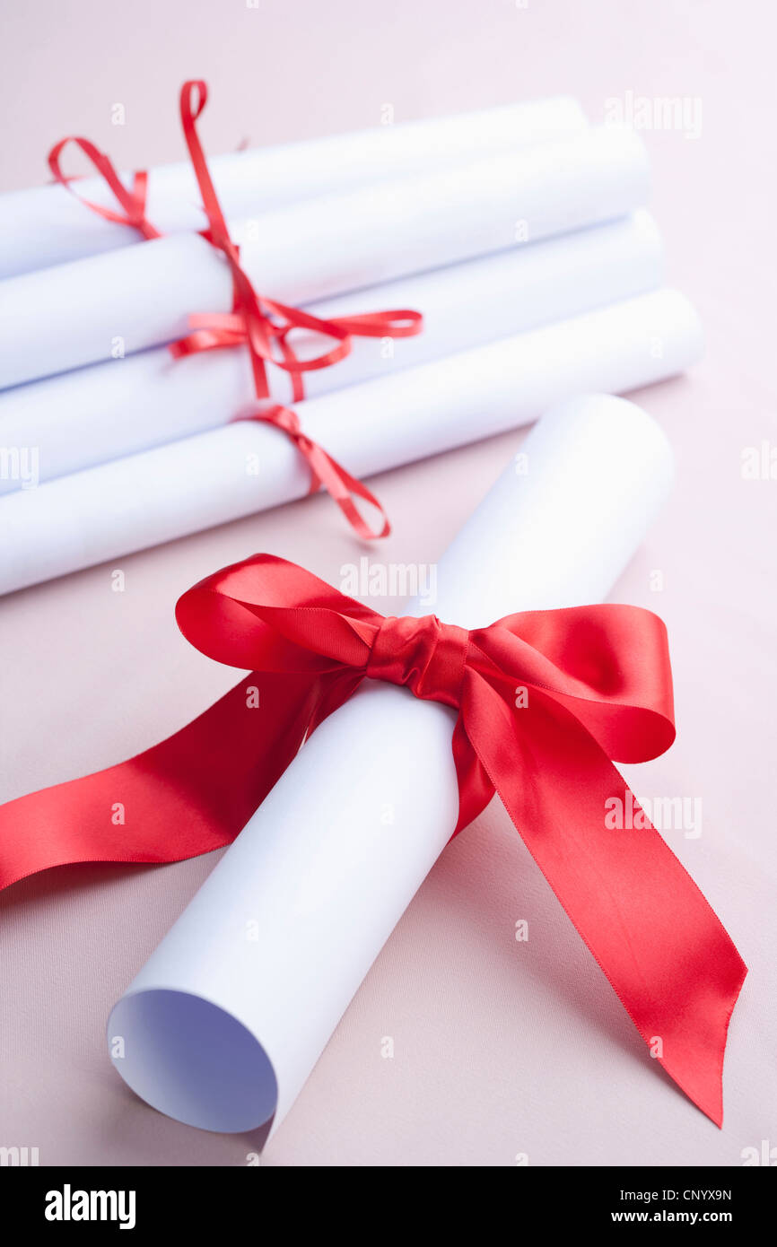 The diploma with red ribbon Stock Photo - Alamy