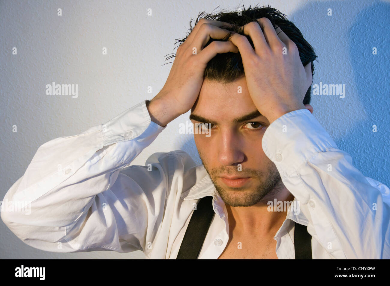 Attractive young man looking straight at camera Stock Photo