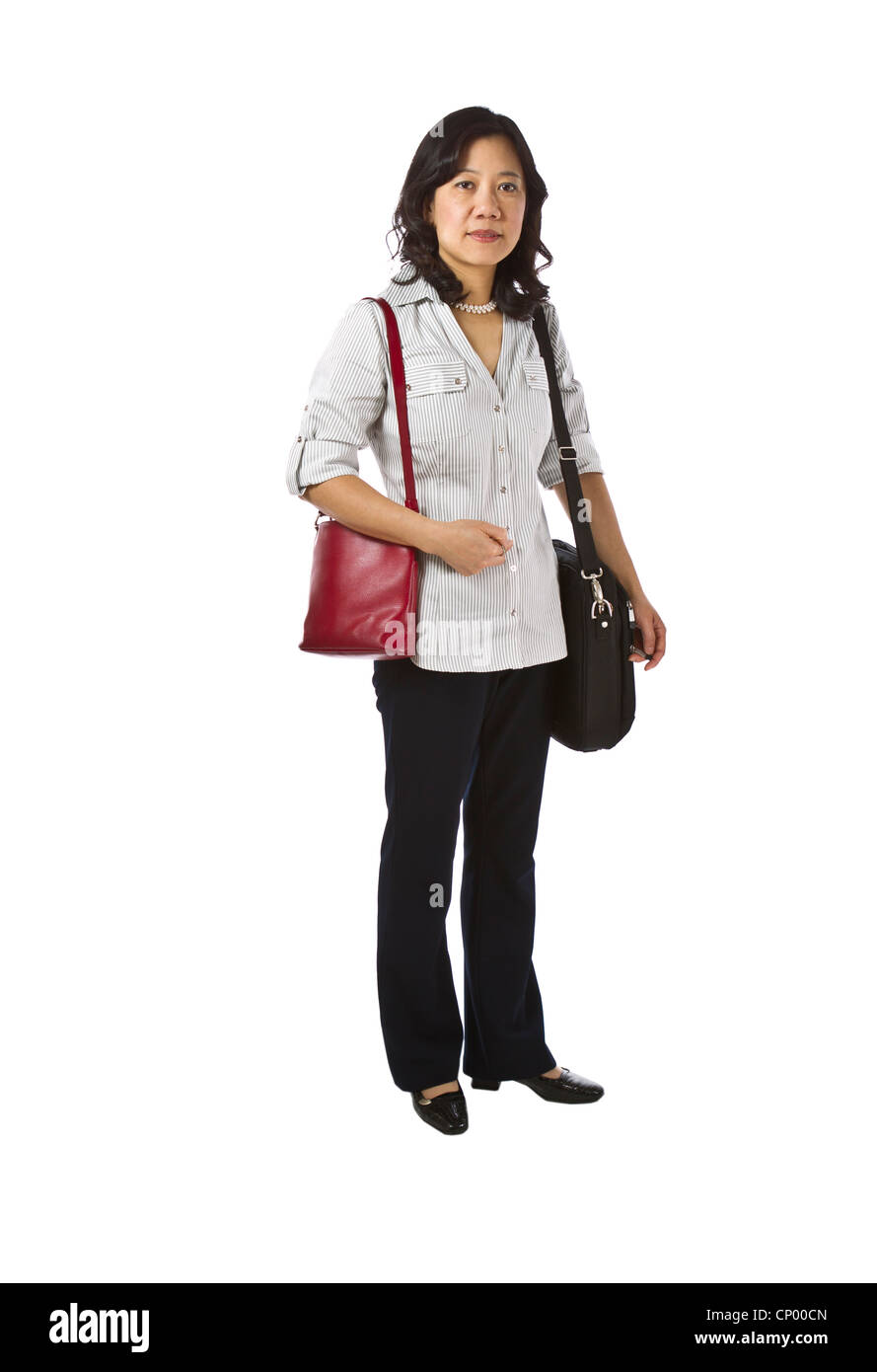 Asian women carry purse and laptop in business causal clothing on white background Stock Photo
