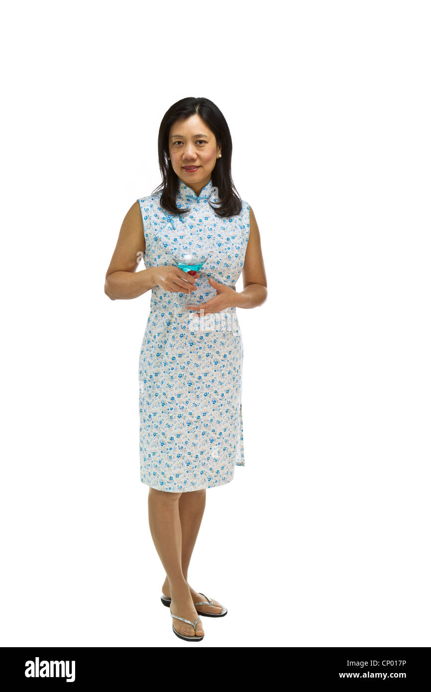 Asian Woman wearing causal dress with drink in hand on white background Stock Photo