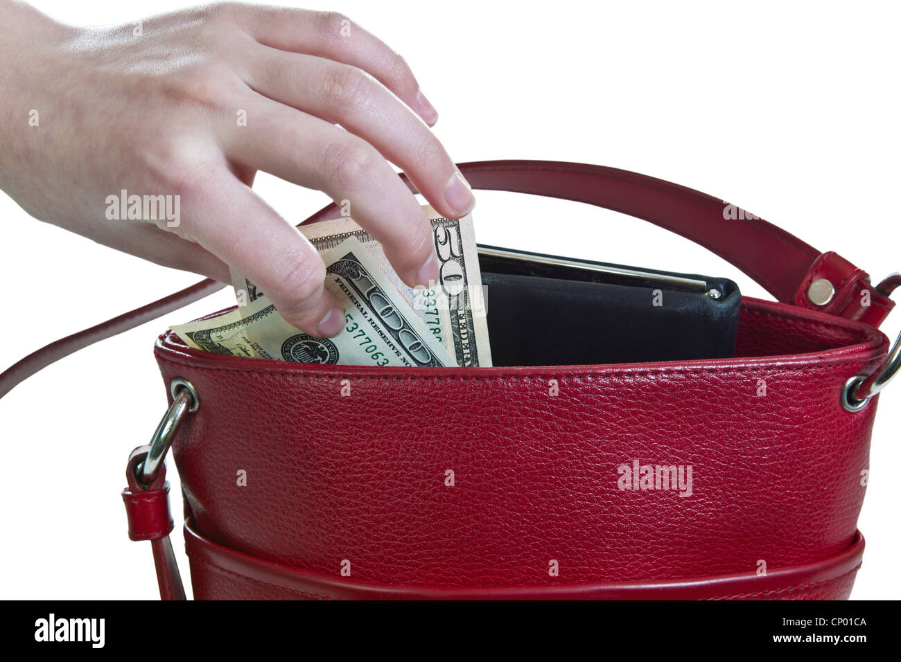 Money being taken out of red purse on white background Stock Photo