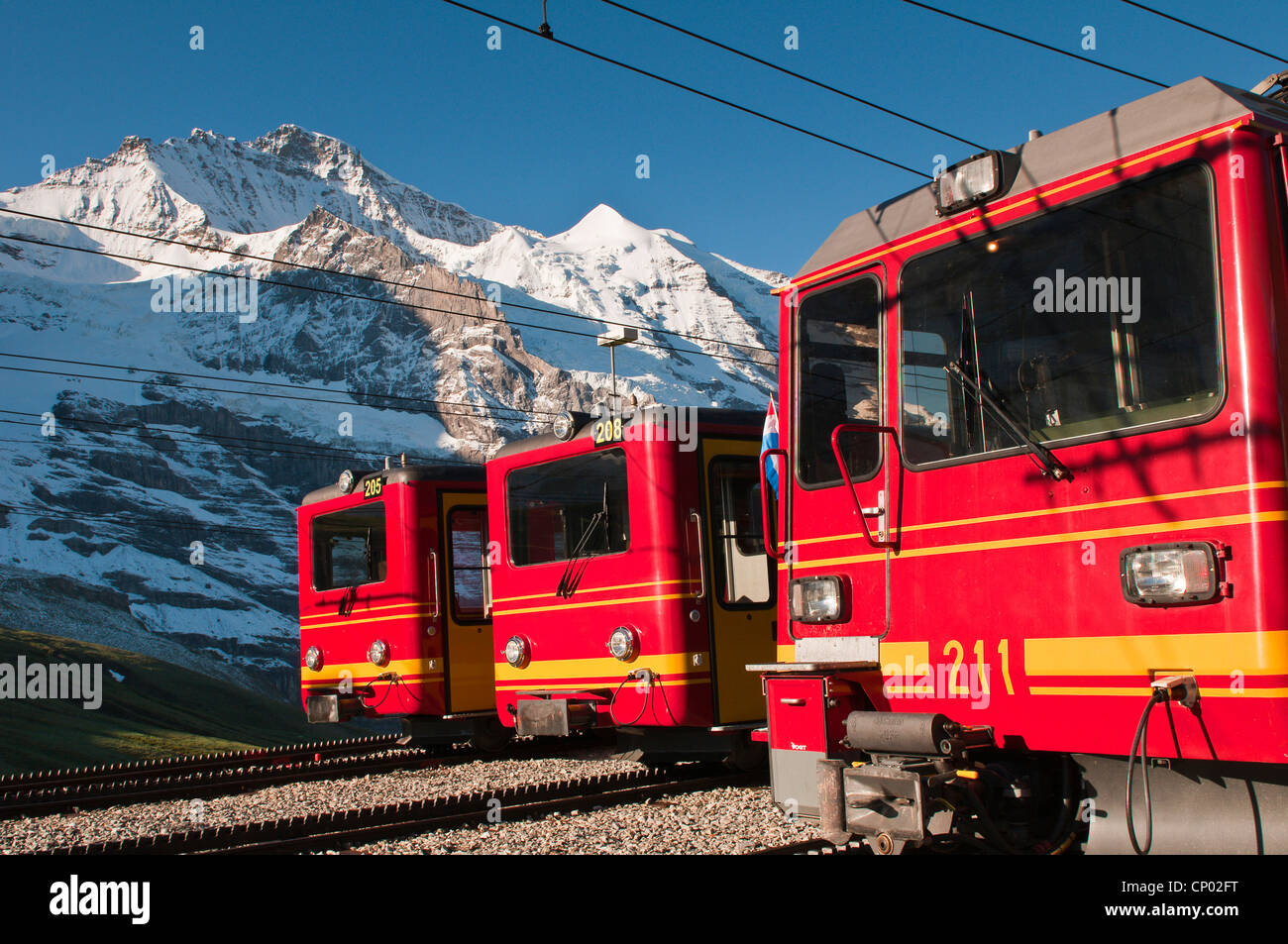 Jungfrau massif and Jungfraujoch train in Kleine Scheidegg, Switzerland, Bernese Oberland Stock Photo