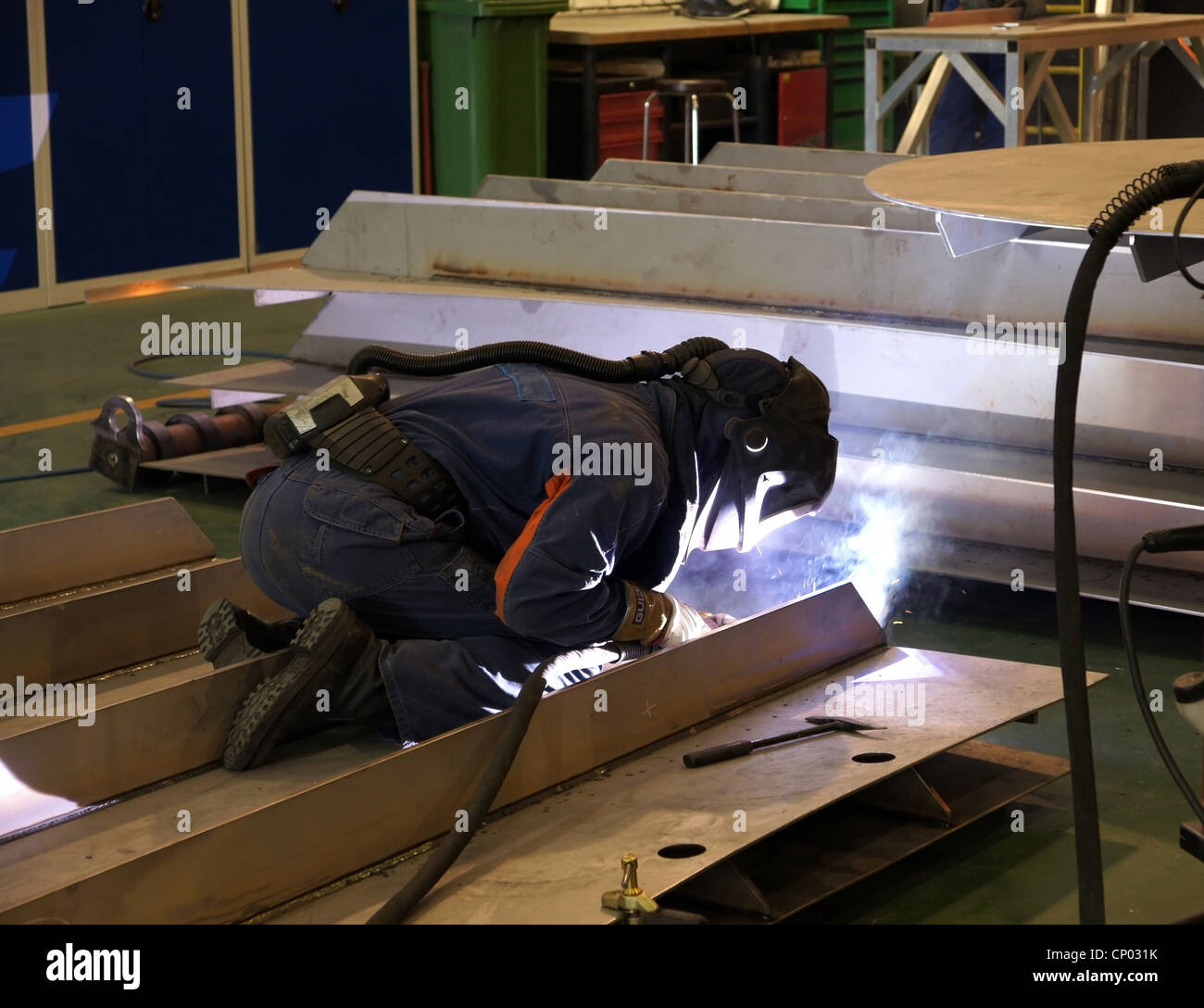 Factory worker welding metal Stock Photo