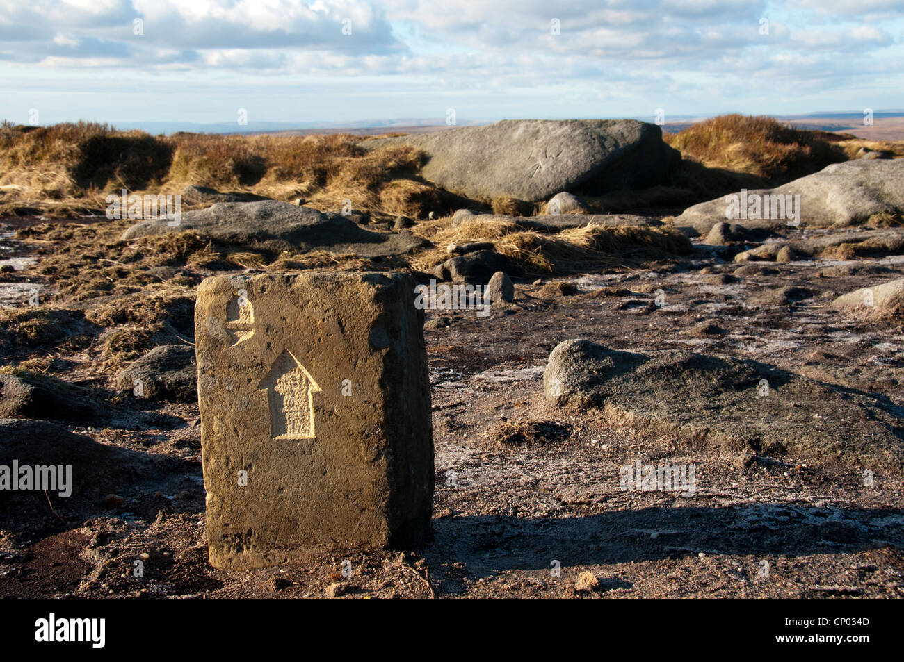 Pennine Way footpath marker stone at Bleaklow Head, Peak District, Derbyshire, England, UK Stock Photo