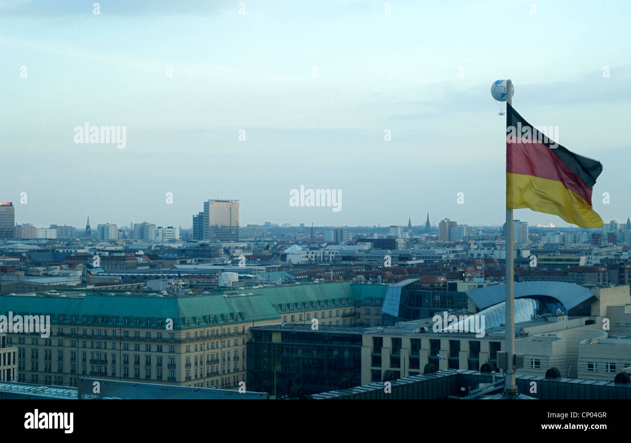 View over Berlin from the Reichstag building with German flag Stock Photo