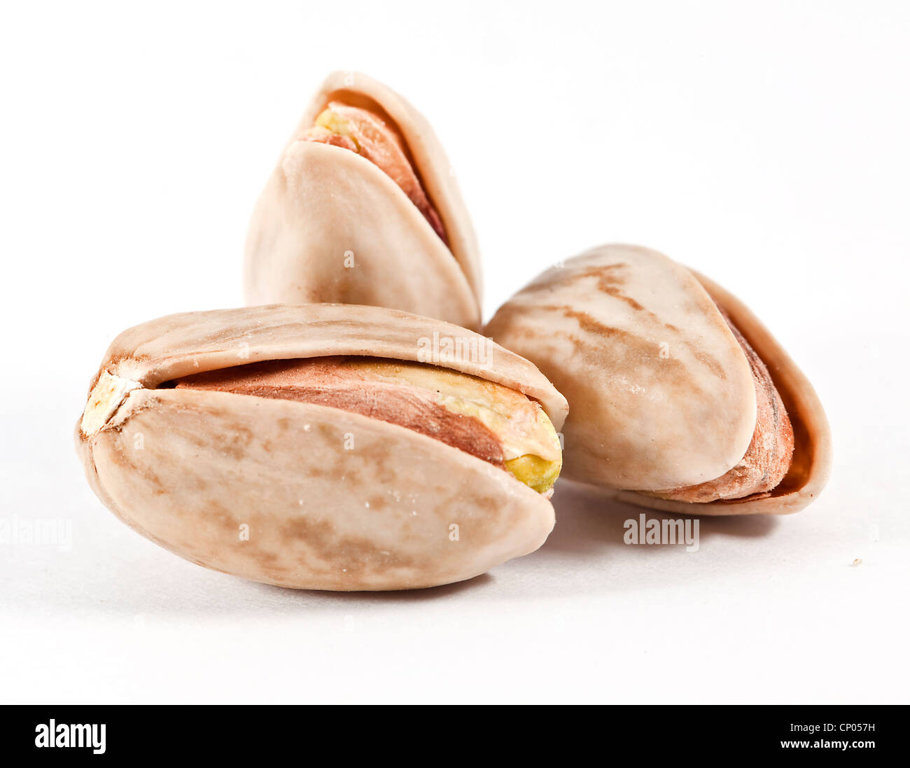 Pistachio on the white background close up Stock Photo - Alamy