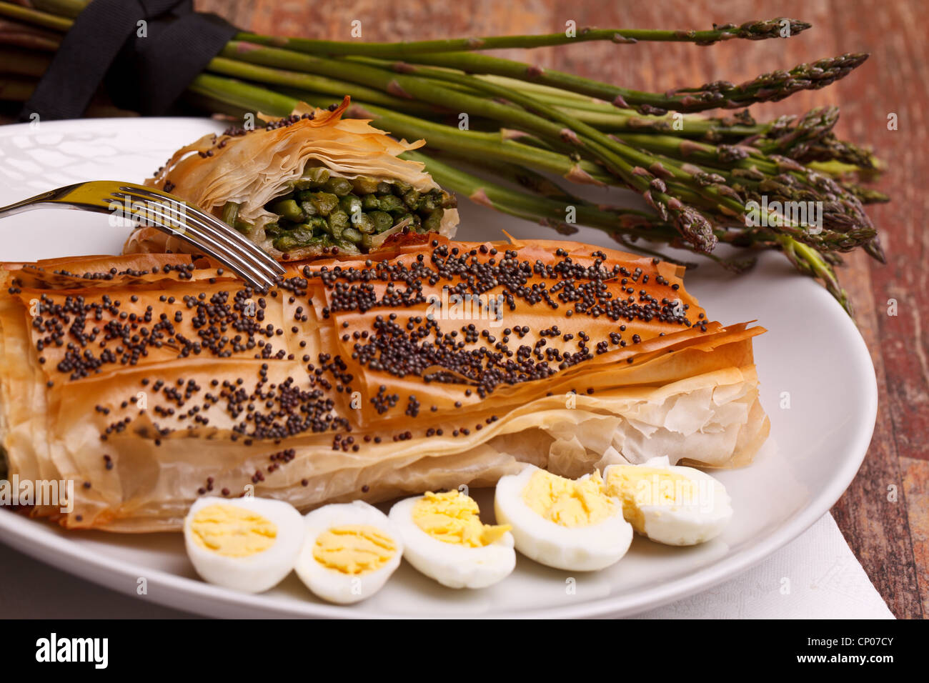 Asparagus In Crust With Poppy Seeds And Quail Eggs Stock Photo