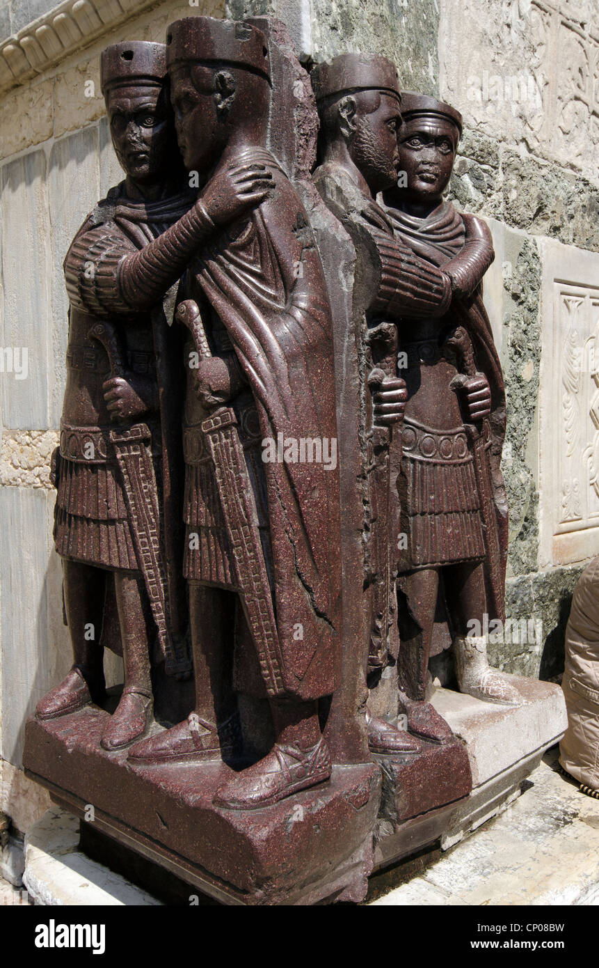 Sculpture of Four Tetrarchs near a gate in the Doge's Palace - sestiere San Marco, Venice - Italy The Portrait of the Four Tetrarchs is a sculpture group of four Roman emperors, wedged into a corner on the facade. Stock Photo