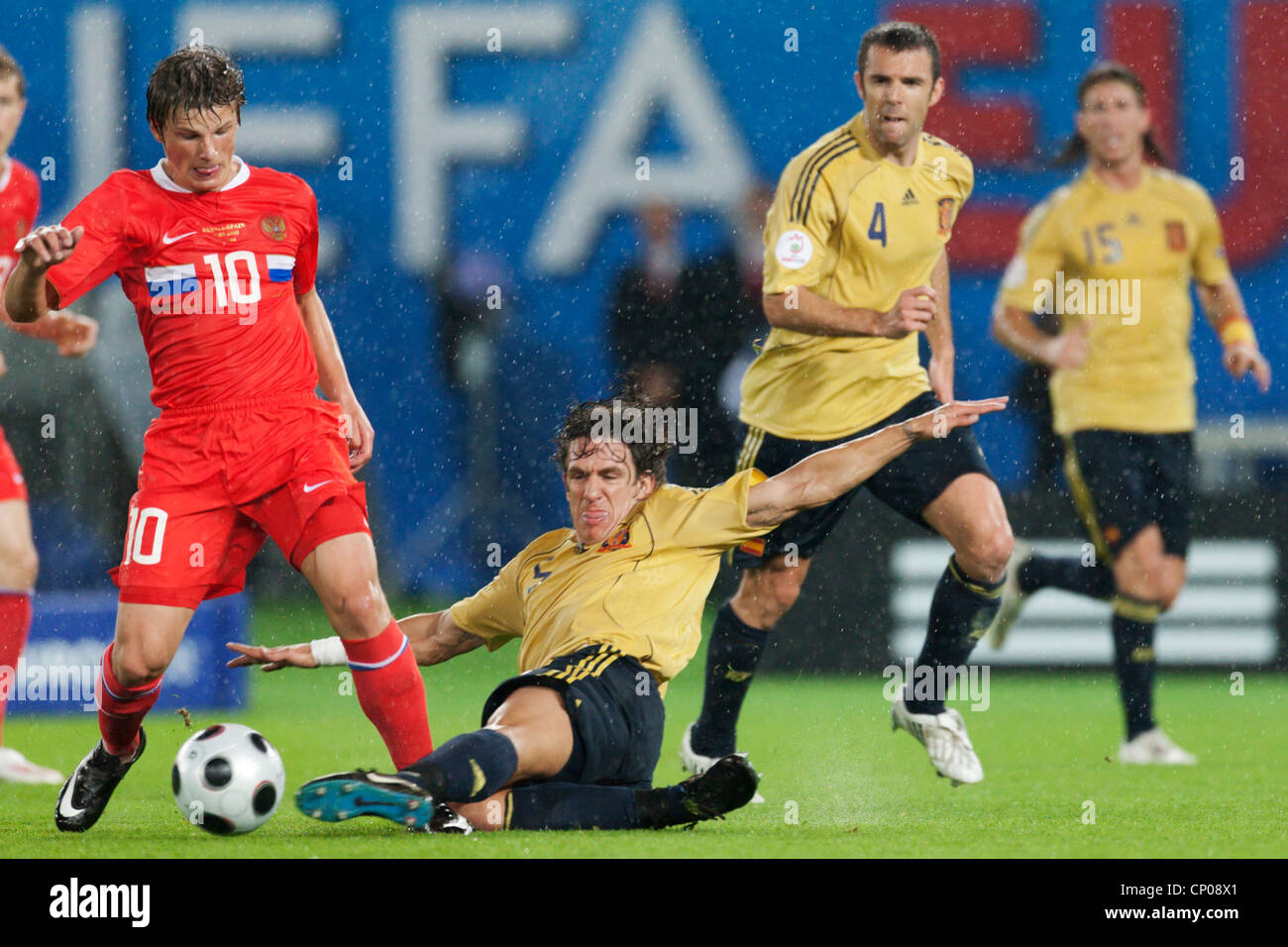 Carles Puyol of Spain (R) tackles Andrei Arshavin of Russia (L) during a UEFA Euro 2008 semifinal match on June 26, 2008. Stock Photo