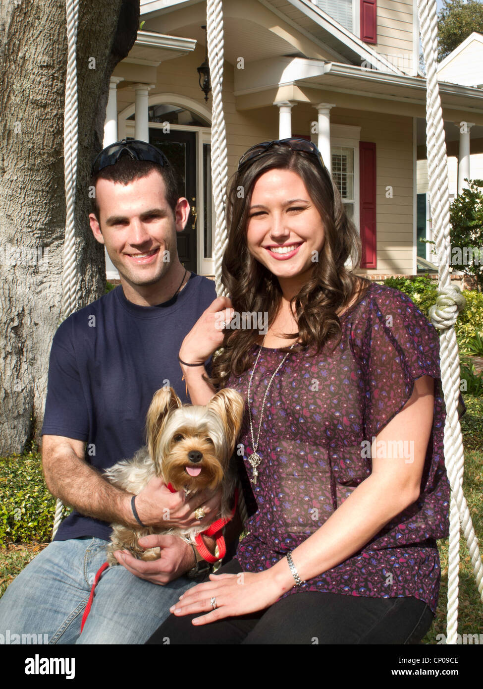 Young Couple and Pet Dog Portrait Stock Photo - Alamy