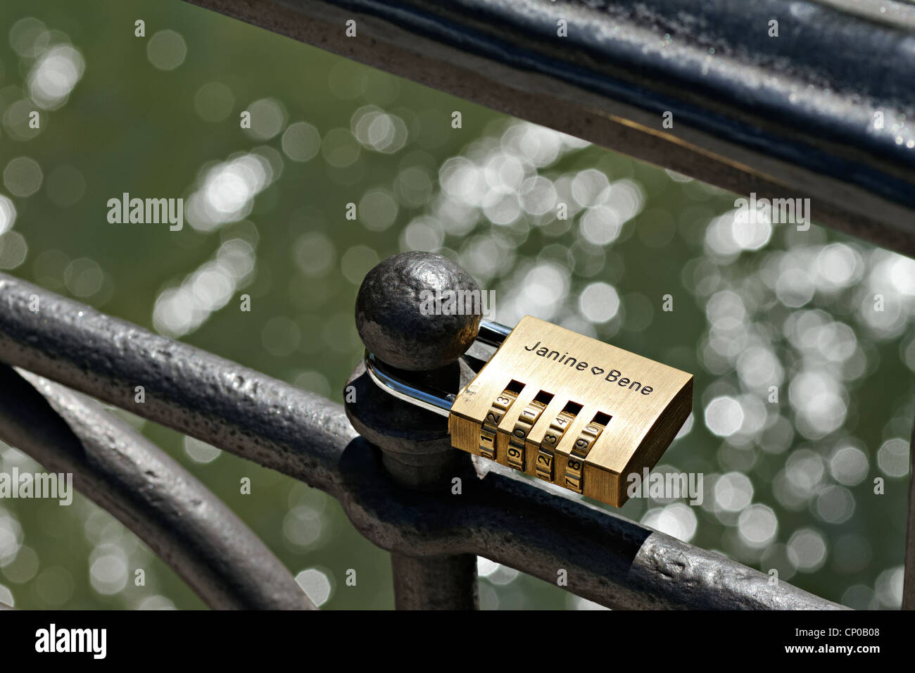 Love lock attached to a bridge railing over the Eisbach ( Ice River