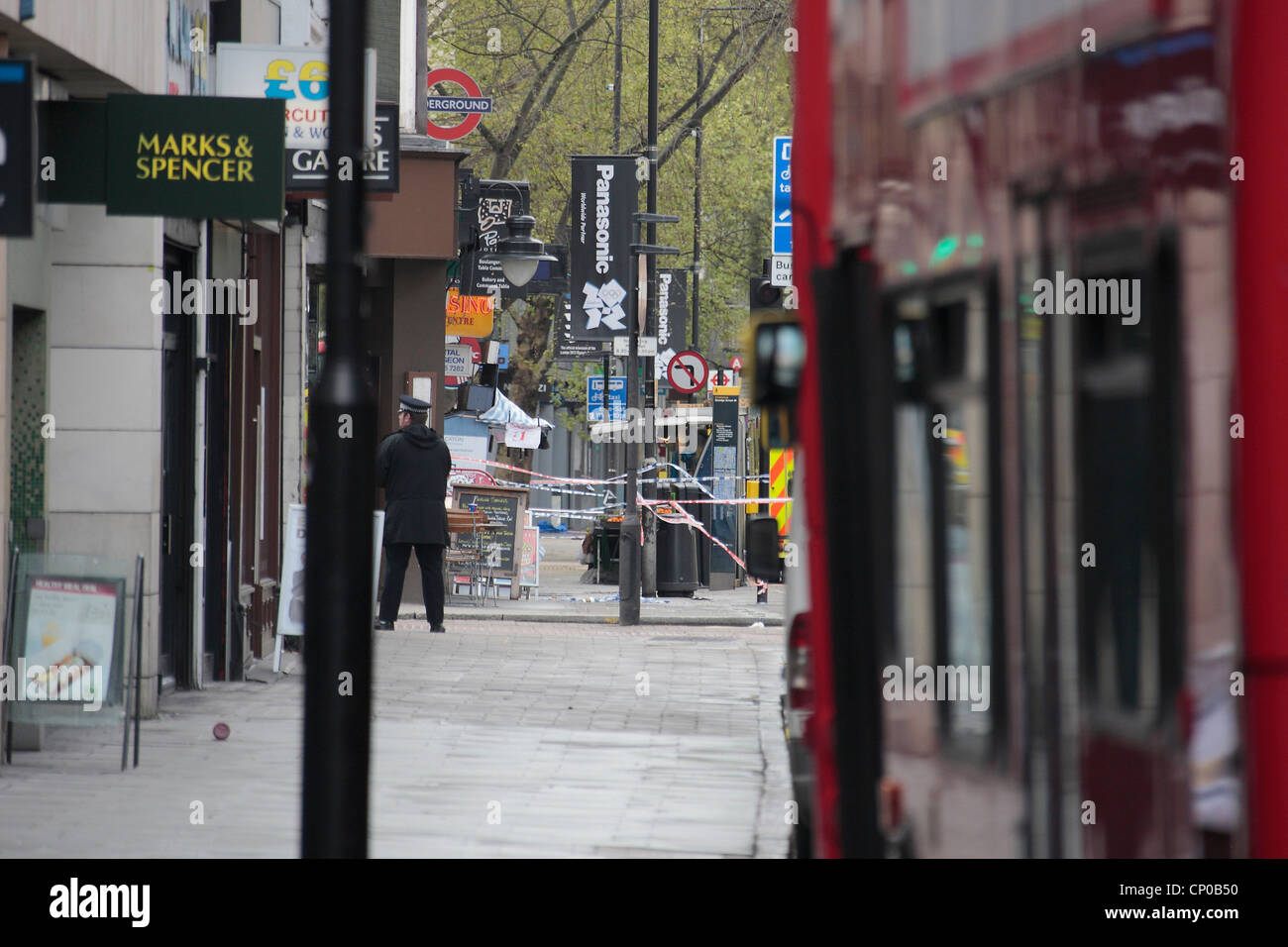 A police officer stands on a cordon during a siege on Tottenham Court Road, Friday 27 April 2012 Stock Photo