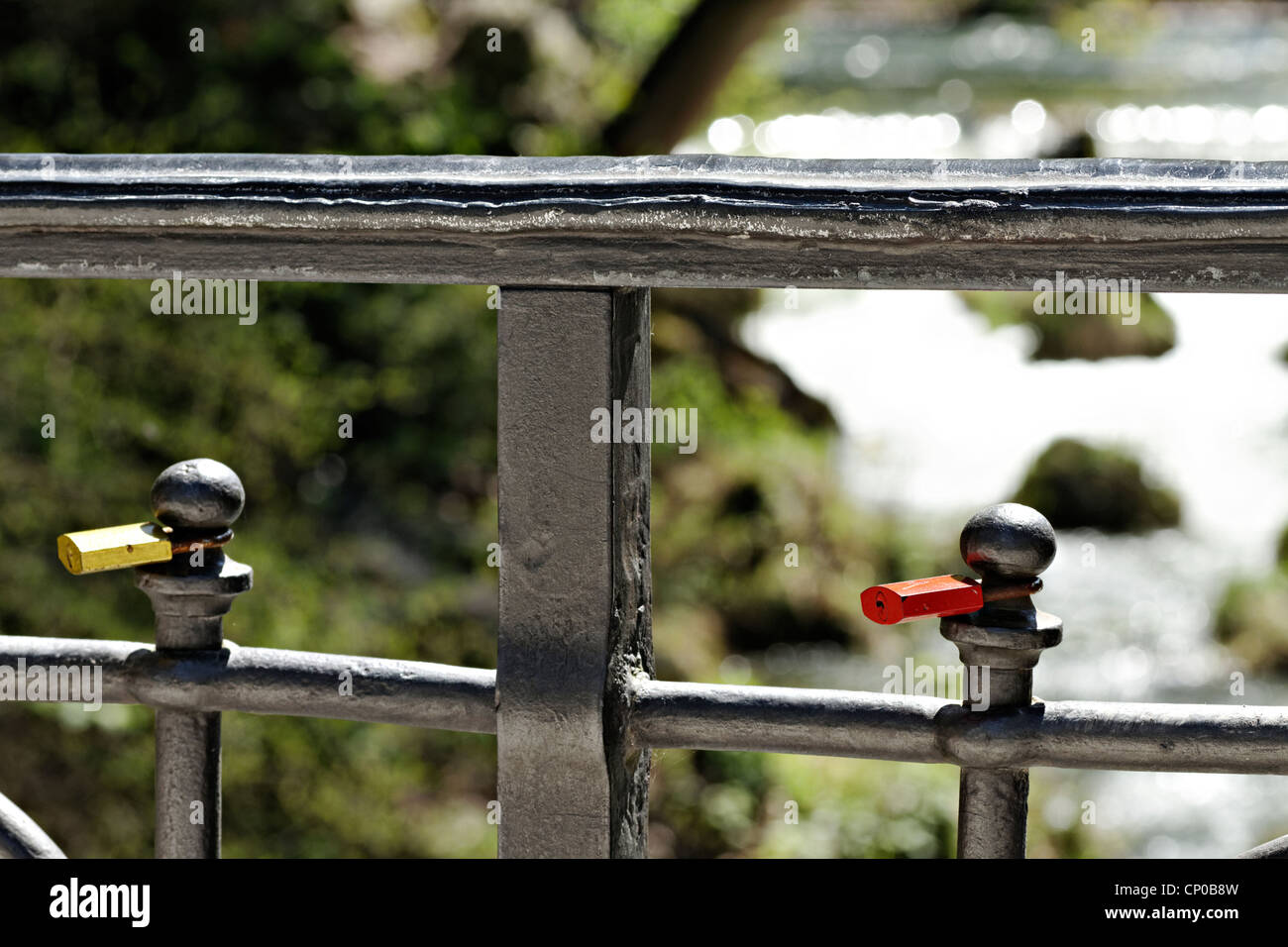 Love locks attached to a bridge railing over the Eisbach ( Ice River