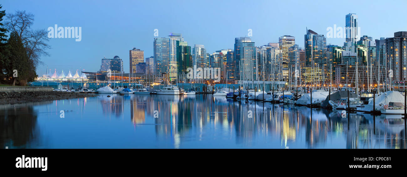 Vancouver BC City Skyline along False Creek by Stanley Park at Blue Hour Stock Photo