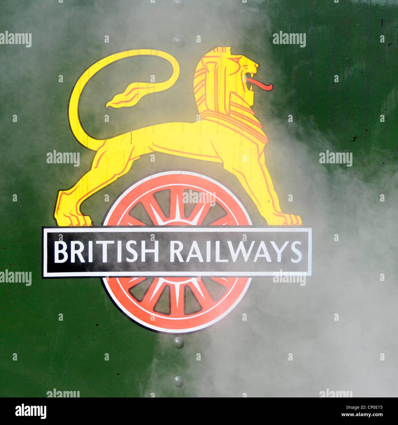 Steam swirling over cycling lion coat of arms crest used on British Railways locomotive 1948 to1956 here on steamed up Britannia 70000 Euston UK Stock Photo