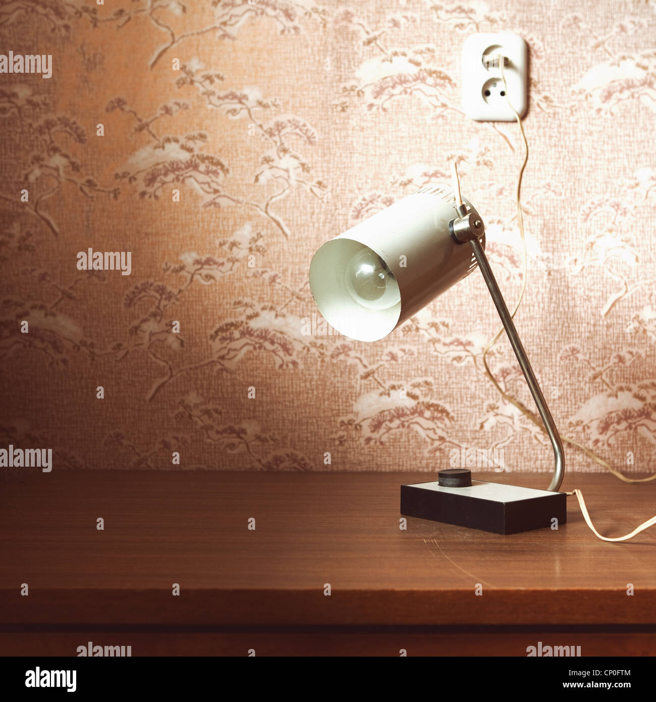 Old Fashioned Desk Lamp On The Table Near The Wall Stock Photo