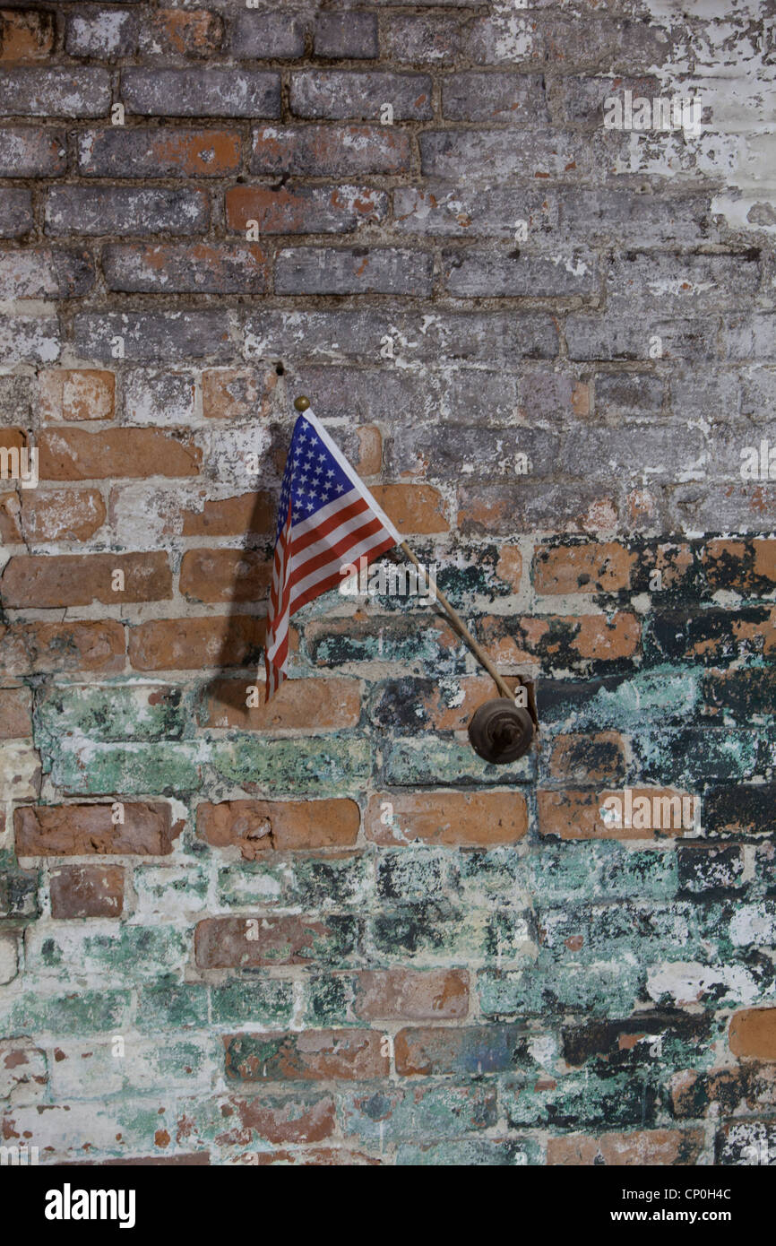 Small American Flag on a painted brick wall Stock Photo - Alamy
